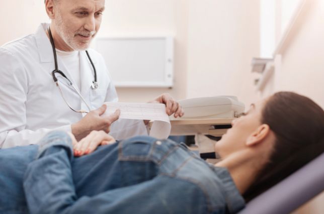 Cardiologist showing a patient their test results at a hospital in Palisades, NY